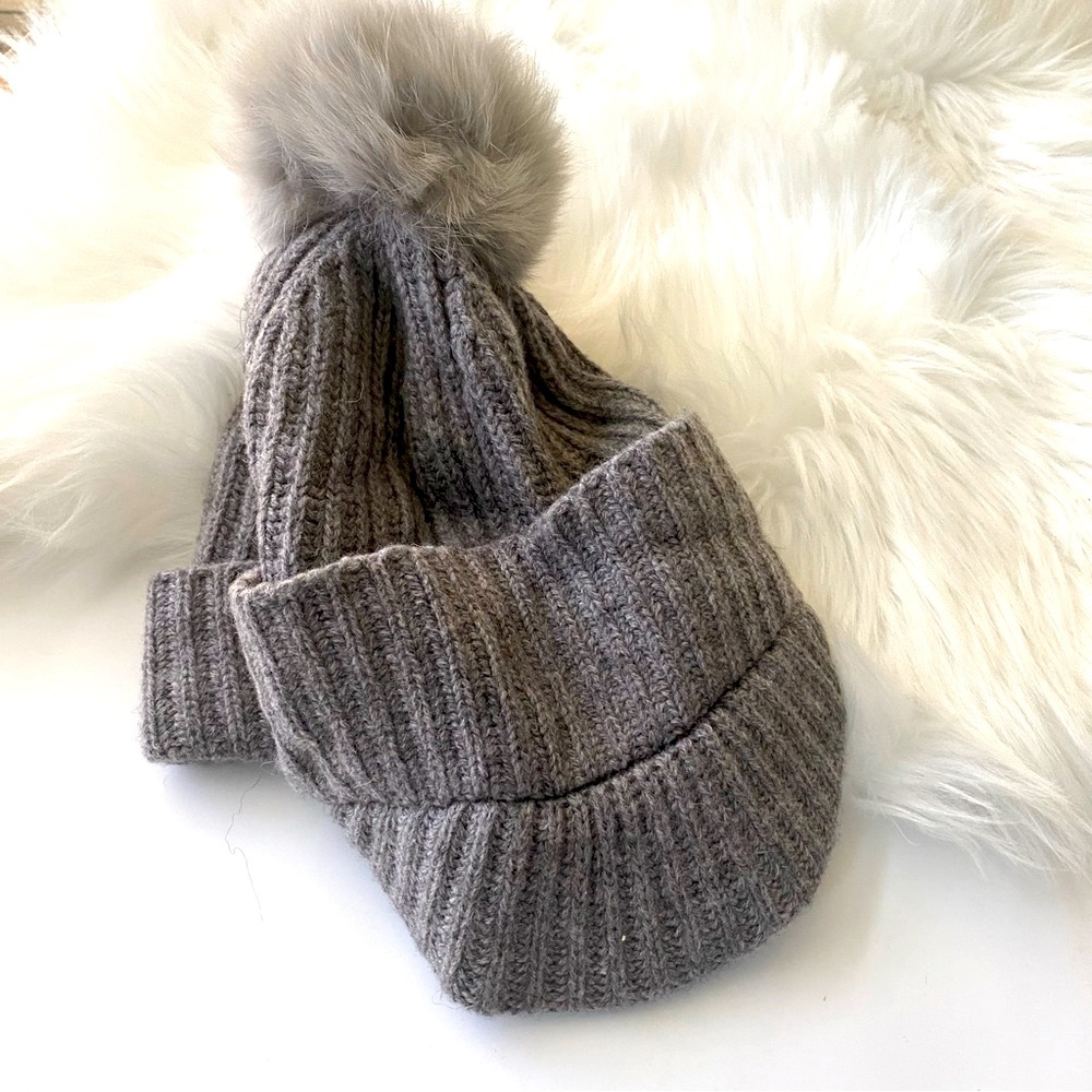 Michael Kors paperboy beanie with Pom Pom and never worn!  NWOT
